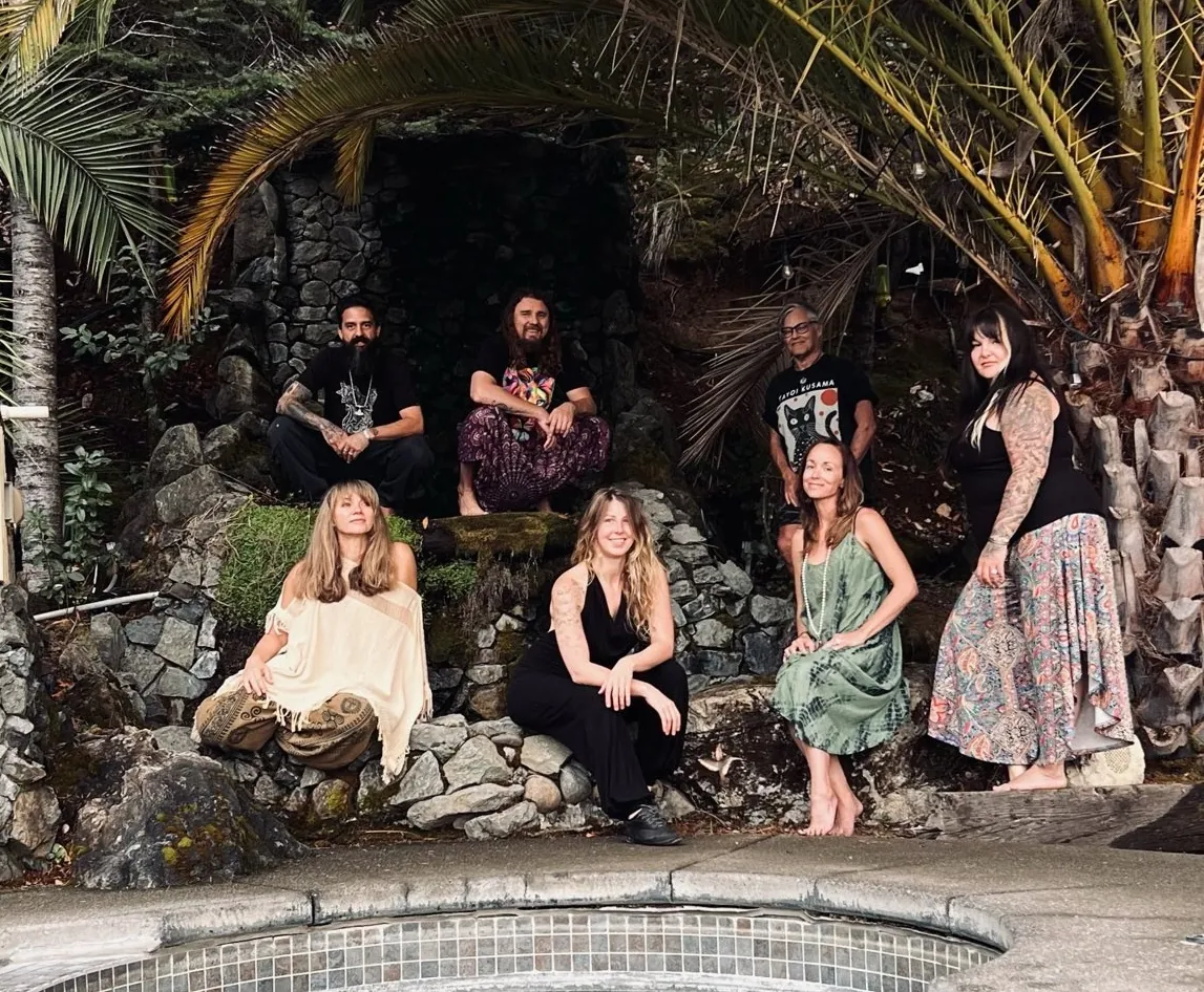 An apprenticeship cohort seated together beside a pool