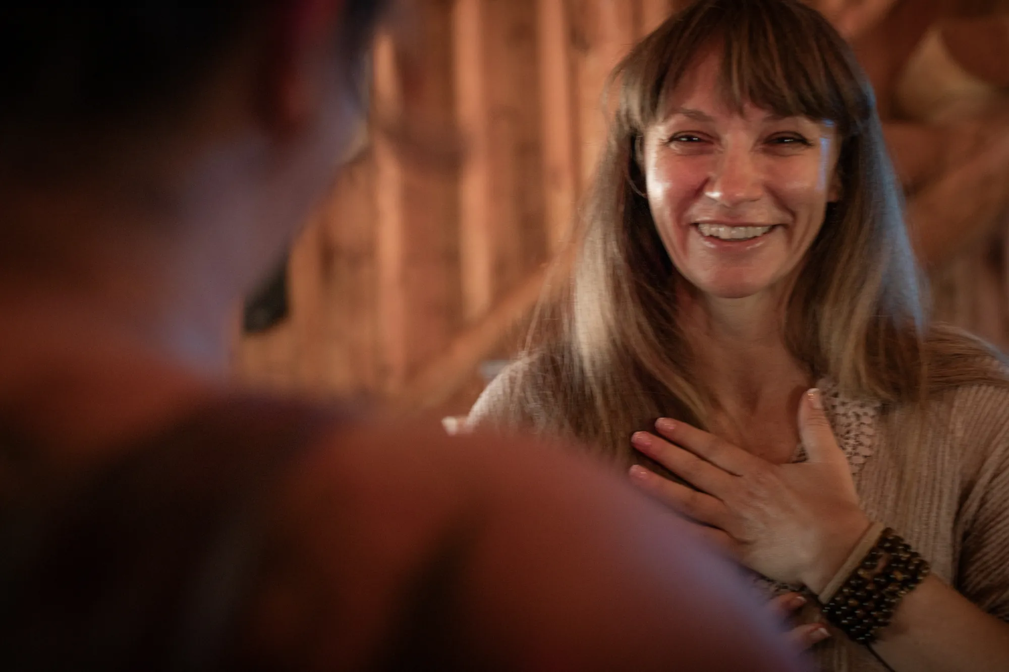 Lana Elco smiling, one hand on her heart